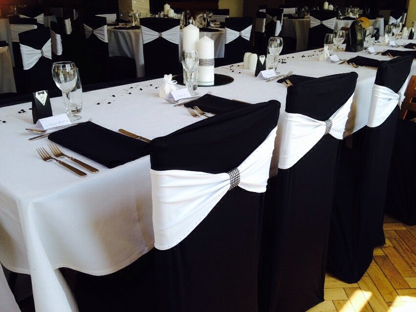 White lycra bands with bling wraps and black lyrca chair covers at Cromwell Manor
