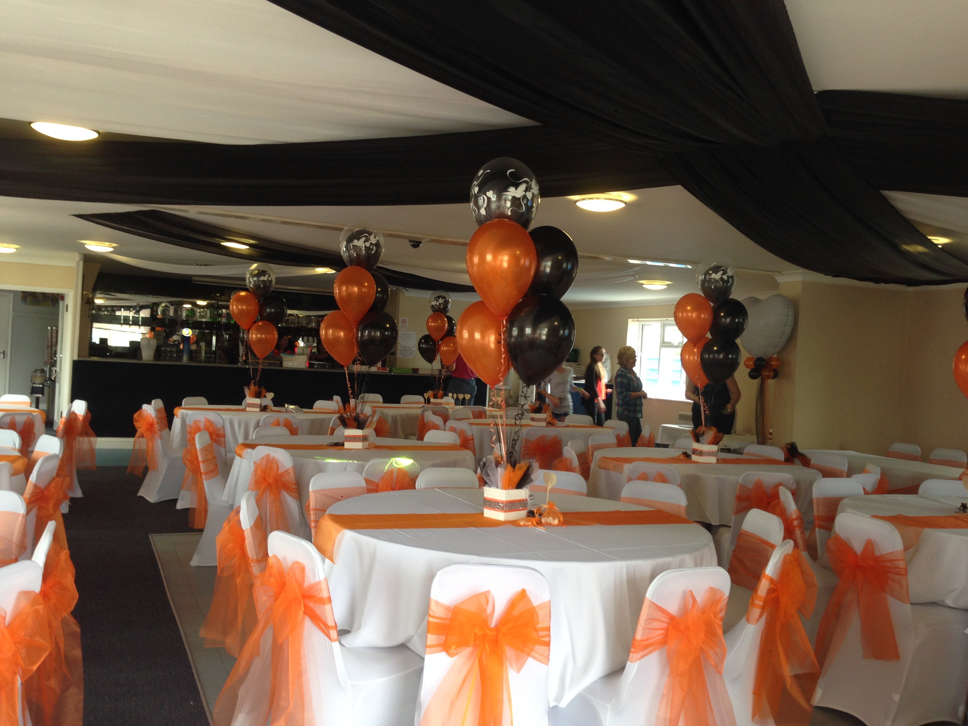 Orange organza sashes and white chair covers and Concord Rangers FC